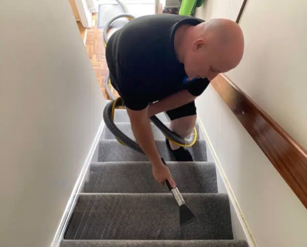 Russell deep cleaning a stair carpet with professional extraction equipment