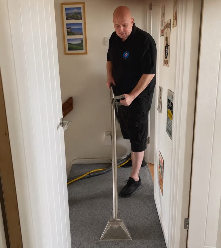 Russell cleaning a hallway carpet
