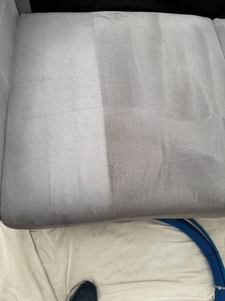 Cream sofa cushion half cleaned